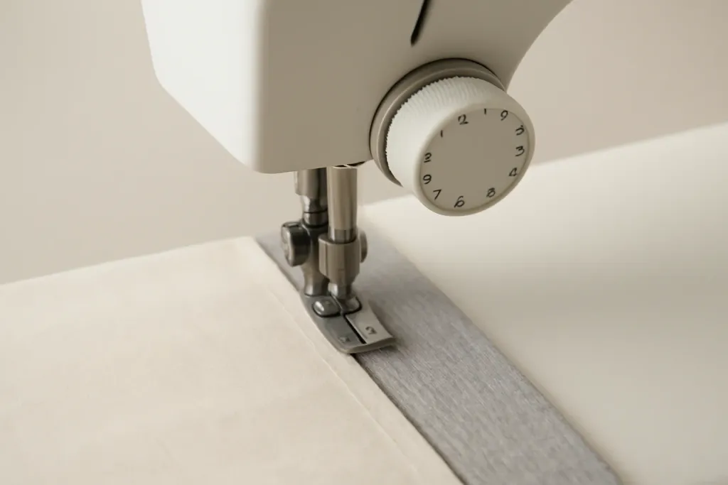 Close-up detail photo related to dialing in thread tension for cotton woven vs stretch knit